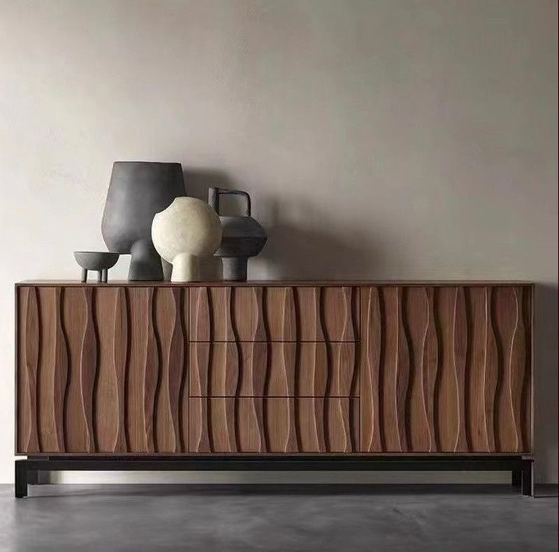 Walnut sideboard with sculpted wave-front doors