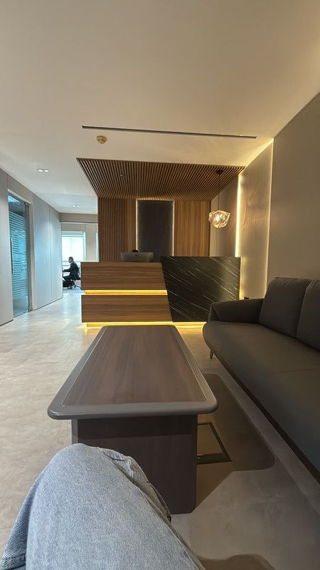 Office lounge with timber table and built-in seating