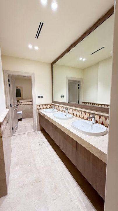 Long double vanity with timber cabinetry